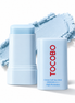 Protector solar en barra Tocobo Cotton Soft Sun Stick SPF50+ PA++++ junto a su textura azul